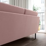 The GRILLSTORP sofa in pink plush cushions and high legs for easy cleaning. Its modern design fits well in spacious rooms.