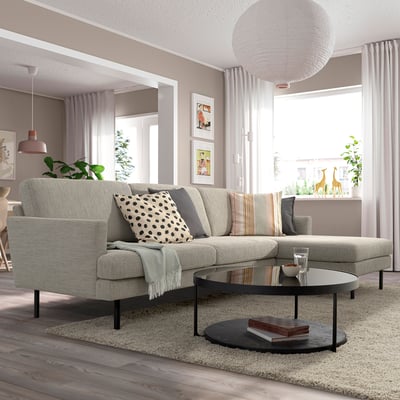 A cosy living room with a GRILLSTORP sofa, coffee table, and large window.