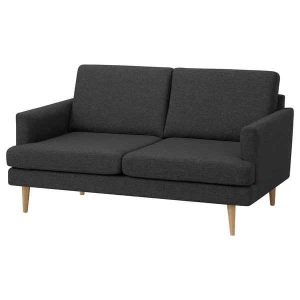A modern dark gray GRILLSTORP loveseat with wooden legs, offering a clean and inviting design.