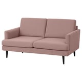 GRILLSTORP pink fabric sofa. U-shaped, with cushioned seats & backs. Dark wooden legs.