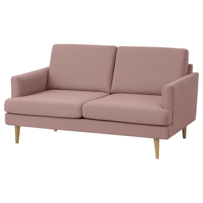 A GRILLSTORP sofa. Its a 2-seat pink fabric sofa with wooden legs, designed for comfort and easy cleaning.