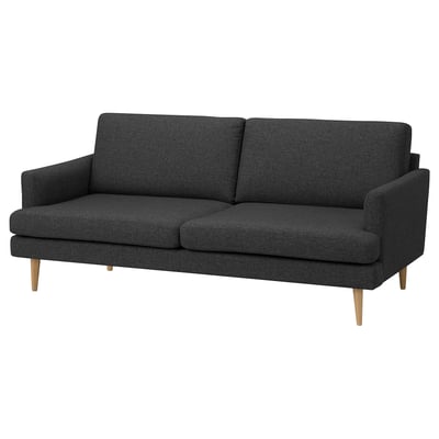 A grey GRILLSTORP sofa with sleek design and wooden legs, perfect for comfort and modern homes.