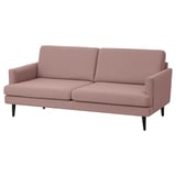 A GRILLSTORP pink fabric sofa with sleek legs, providing a clean and inviting design for comfort.