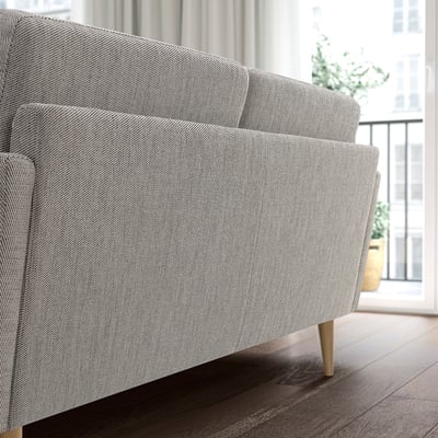 Gray GRILLSTORP sofa by window