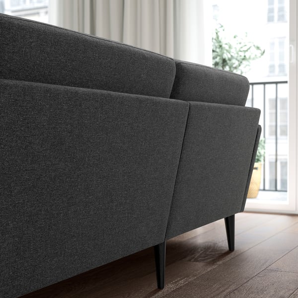 Dark grey GRILLSTORP sofa with sleek legs, minimalist design, comfortable cushions, high legs.