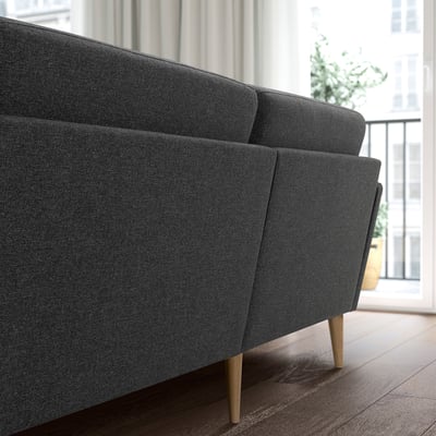 The GRILLSTORP grey 4-seat sofa clean lines, pocket spring seat cushions, and sturdy oak legs, blending modern comfort with practicality.