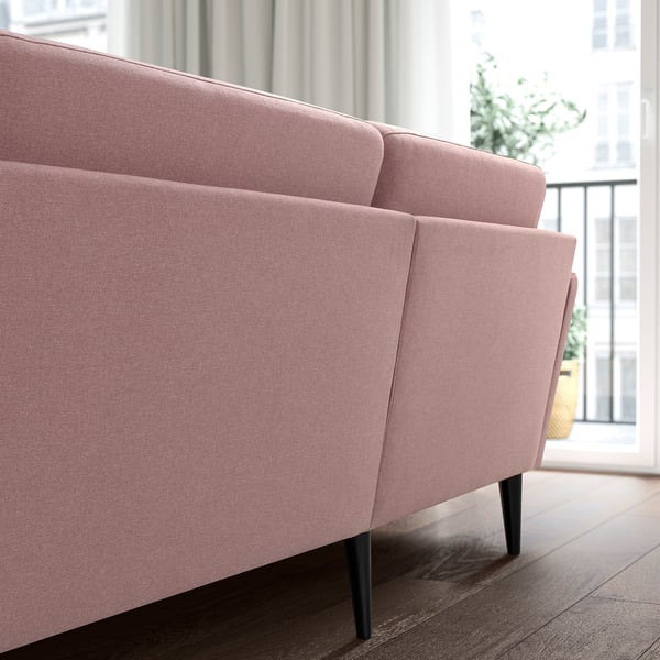 Light pink GRILLSTORP sofa with dark wood legs, four-seater, by bright window.