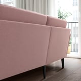 Light pink GRILLSTORP sofa with dark wood legs, four-seater, by bright window.