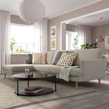 Light grey GRILLSTORP 4-seat sofa with high legs and pocket spring cushions in a cozy living room.