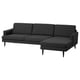 Dark grey modern sofa with chaise, slim legs, three back cushions, inviting design.