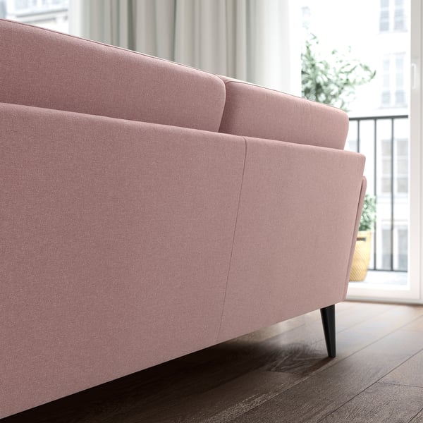 Light pink GRILLSTORP sofa, modern & inviting, large, upholstered, wooden legs.
