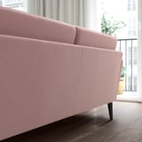 Light pink GRILLSTORP sofa, modern & inviting, large, upholstered, wooden legs.