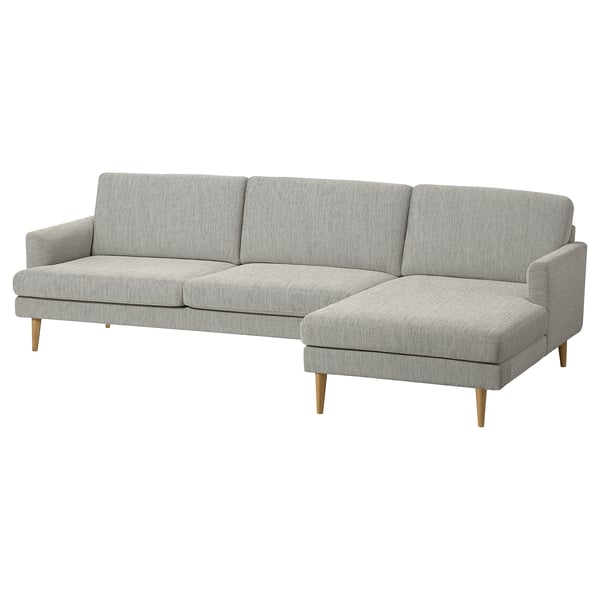 Modern grey l-shaped sofa with light wood legs, clean lines, and inviting cushions.