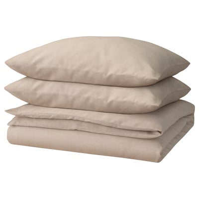 Beige GROVSNÄRJA bed set, made of 100% cotton, with duvet and two pillows, neatly folded.