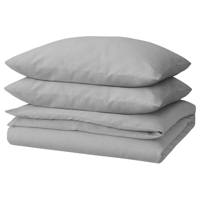 A stack of three light grey, rectangular pillows made from 100% cotton, featuring a simple design.