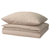 Beige bedding set by grovsnarja, made of cotton, featuring a simple, folded design with zipper closure at the bottom.