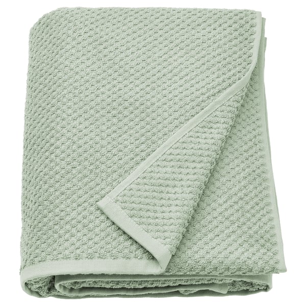 A folded sage green GULVIAL cotton towel, soft and thick, with a textured surface and neat edges.