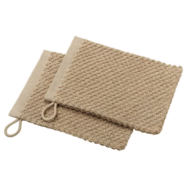 Two beige cotton washing mitts with loop for hanging, neatly folded.