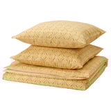 A stack of yellow mustard-colored bedding: 2 pillows and a flat sheet with floral patterns, made of cotton and viscose.
