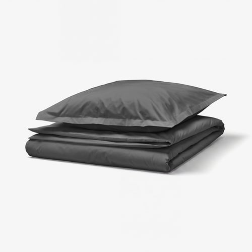 Stacked dark grey bedding: duvet and pillow with zip closures.