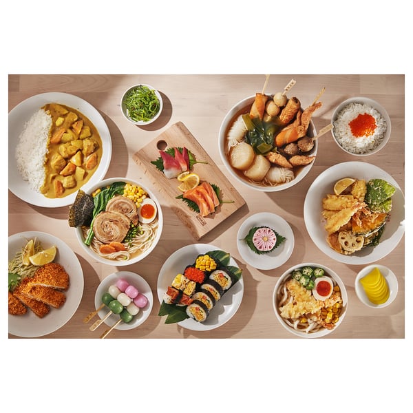 Japanese dishes: sushi, tempura, ramen, rice bowls on wooden table