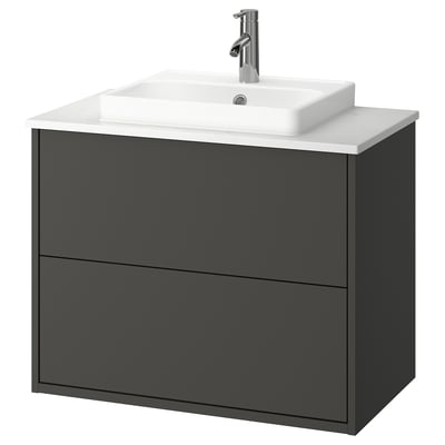Modern grey bathroom vanity with white countertop and sink.