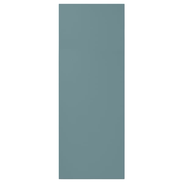 A turquoise HAVSTORP cabinet door with a smooth, modern design.