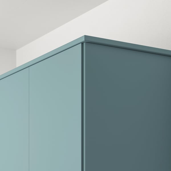 Modern turquoise kitchen trim, hides lighting, cords and sockets, fits metod series.