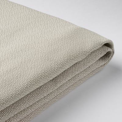 A close-up of a soft, textured fabric in beige color, likely a part of a mattress cover, showcasing its quality and texture.