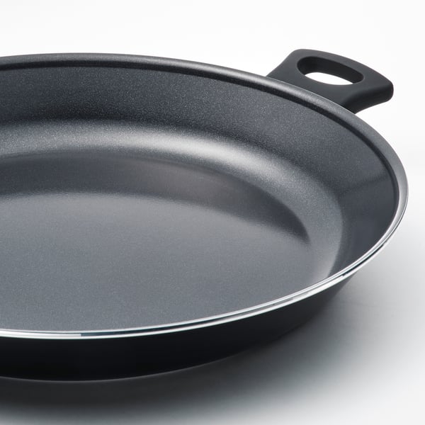 Black frying pan with non-stick coating and sturdy handle, showcasing its high-quality surface and design.