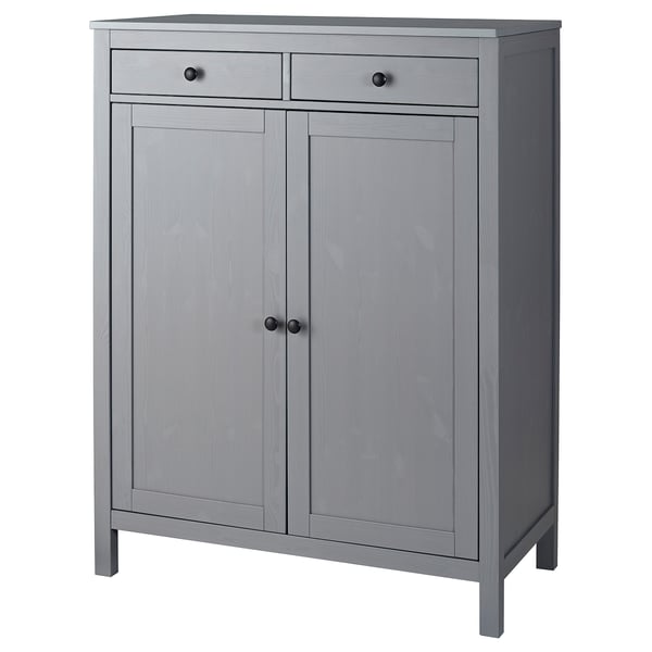 A gray wooden HEMNES cabinet with two doors and two drawers, a classic design for storage.