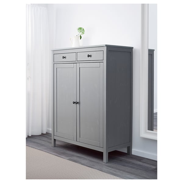 Gray wooden cabinet with two doors and drawers. Simple, classic design.