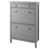 A gray HEMNES shoe cabinet with multiple compartments. It is made of solid pine and has a clean, rectangular design.