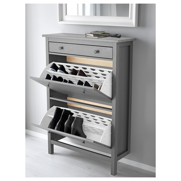 Grey HEMNES shoe cabinet with open doors and top drawer.