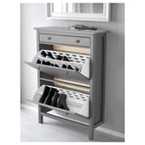 Grey HEMNES shoe cabinet with open doors and top drawer.