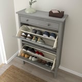 Wall-mounted shoe cabinet with 14 pairs, 6 per drawer.