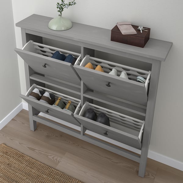 Grey HEMNES shoe cabinet, holds 8 pairs, close to wall.