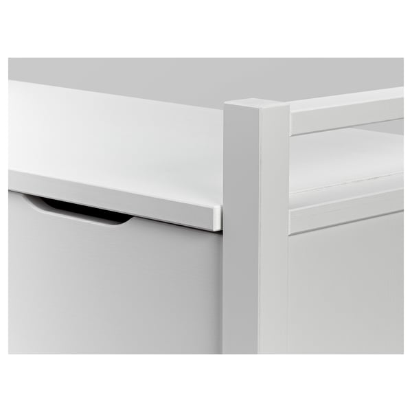 White wooden cabinet close-up; smooth edges, clean finish, drawer slightly open.