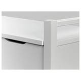 White wooden cabinet close-up; smooth edges, clean finish, drawer slightly open.