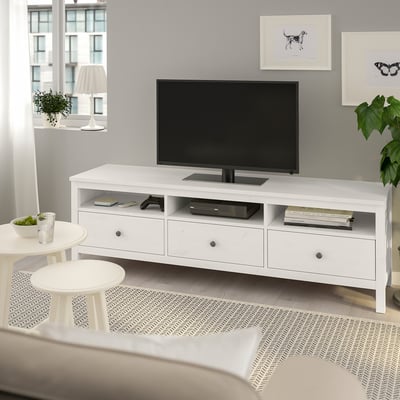 Modern living room with large white HEMNES tv stand, flat screen, drawers, and decor.