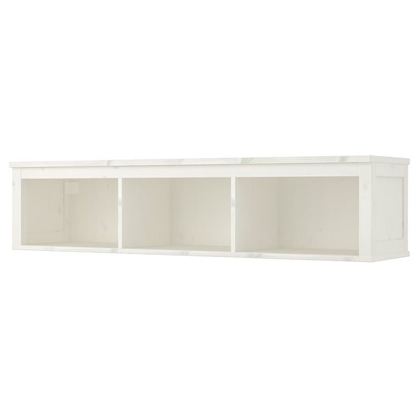 A HEMNES white wall shelf made of solid pine and fiberboard. It has a rectangular, minimalist design with three open compartments.