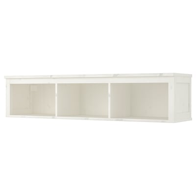 A HEMNES white wall shelf made of solid pine and fiberboard. It has a rectangular, minimalist design with three open compartments.