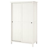 A white HEMNES wardrobe with sliding doors, made of solid pine and fibreboard. It a classic design for hanging and folded clothes.