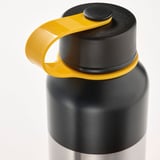 Black insulated flask with yellow handle and stoppper, designed for travel.