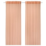 Two peach-colored sheer curtains hang side by side, featuring a simple, sleek design with rod pockets at the top.