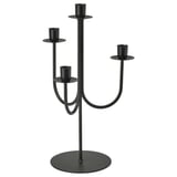 Black metal candelabra with four arms, holding candles. Modern and stable design.