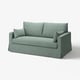A light green, modern sofa with a clean look and soft cushions.