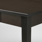 Dark wood table corner, smooth finish, sturdy joint detail.
