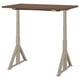 An IDÅSEN adjustable desk in beige with a brown top. The desk a sturdy, height-adjustable stand and a cable management solution.