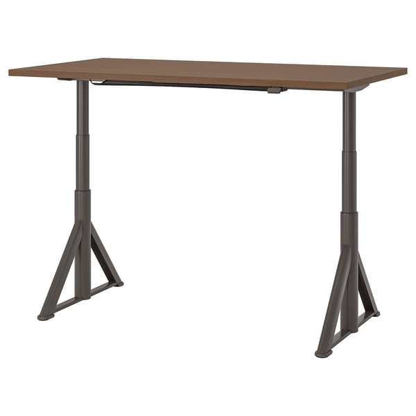 Brown IDÅSEN desk with adjustable legs for sitting or standing.